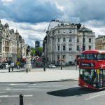 Central London - red and black bus on road near building during daytime