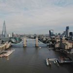 London City - gray bridge in between of buildings