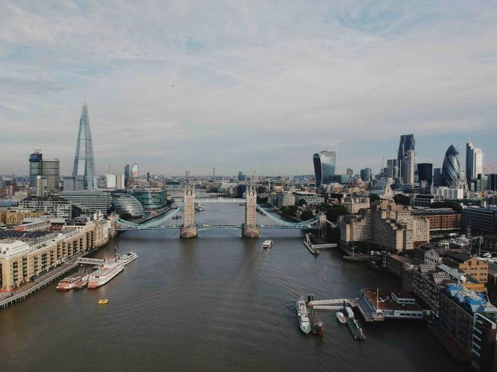 London City - gray bridge in between of buildings