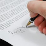 Documents - Person Signing in Documentation Paper